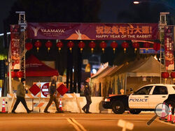 FBI agents walk near a scene where a shooting took place in Monterey Park, Calif., Sunday, Jan. 22, 2023. Nine people were killed in a mass shooting late Saturday in a city east of Los Angeles following a Lunar New Year celebration that attracted thousands, police said. (AP Photo/Jae C. Hong)