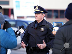 Des Moines Police spokesman Sgt. Paul Parizek speaks outside the Starts Right Here building, Monday, Jan. 23, 2023, in Des Moines, Iowa. Police say two students were killed and a teacher was injured in a shooting at the Des Moines school on the edge of the city's downtown. (AP Photo/Charlie Neibergall)