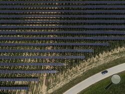 Solar panels are mounted on poles above a hops field near Au in der Hallertau, Germany, Wednesday, July 19, 2023. Solar panels atop crops has been gaining traction in recent years as incentives and demand for clean energy skyrocket. (AP Photo/Matthias Schrader)