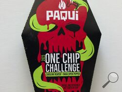 A package of Paqui OneChipChallenge spicy tortilla chips is seen on Thursday, Sept. 7, 2023, in Boston. Authorities are raising the alarm about a OneChipChallenge social media trend that encourages people to avoid seeking relief from eating and drinking for as long as possible after eating the chips, days after a Massachusetts teenager died hours after taking part in the challenge. The dare is popular on social media sites, with scores of people including children unwrapping the packaging, eating the chips 