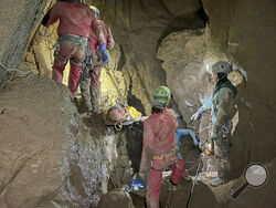 Members of the CNSAS, Italian alpine and speleological rescuers, carry a stretcher with American researcher Mark Dickey during a rescue operation in the Morca cave, near Anamur, southern Turkey, Monday, Sept. 11, 2023. A rescue operation is underway in Turkey’s Taurus Mountains to bring out an American researcher who fell seriously ill at a depth of some 1,000 meters (3,000 feet) from the entrance of one of world’s deepest caves last week and was unable to climb out himself. Mark Dickey is being assisted by