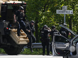 Law enforcement officers gather as the search for escaped convict Danelo Cavalcante continues Tuesday, Sept. 12, 2023, in Pottstown, Pa. (AP Photo/Matt Rourke)