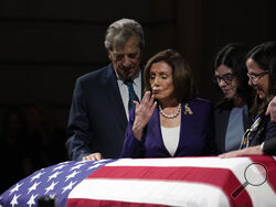 U.S. Rep. Nancy Pelosi, D-Calif. second from left, surrounded by her husband Paul, left, Katherine Feinstein, second from right, and daughter Nancy Pelosi, right, blows a kiss at the casket of U.S. Sen. Dianne Feinstein at the City Hall Wednesday, Oct. 4, 2023, in San Francisco. Feinstein, who died Sept. 29, served as San Francisco's mayor. (AP Photo/Godofredo A. Vásquez)