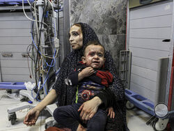  =Wounded Palestinians wait for treatment, at the al-Shifa hospital, in Gaza City, central Gaza Strip, Tuesday, Oct. 17, 2023. (AP Photo/Abed Khaled)