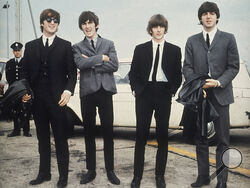FILE - The Beatles, from left, John Lennon, George Harrison, Ringo Starr and Paul McCartney arrive in Liverpool, England on July 10, 1964, for the premiere of their movie "A Hard Day's Night." The final Beatles recording featuring John, Paul, George and Ringo is here. Released Thursday and titled “Now and Then,” the song comes from a batch of unreleased demos written by the late John Lennon in the ’70s. (AP Photo, File)