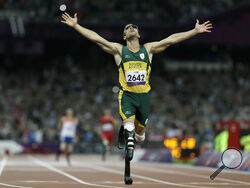 FILE - In this Sept. 8, 2012 file photo, South Africa's Oscar Pistorius wins gold in the men's 400-meter T44 final at the 2012 Paralympics in London. Pistorius could be granted parole on Friday, Nov. 24, 2023 after nearly 10 years in prison for killing his girlfriend. The double-amputee Olympic runner was convicted of a charge comparable to third-degree murder for shooting Reeva Steenkamp in his home in 2013. He has been in prison since late 2014. (AP Photo/Kirsty Wigglesworth, File)