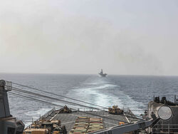 In this image provided by the U.S. Navy, the amphibious dock landing ship USS Carter Hall and amphibious assault ship USS Bataan transit the Bab al-Mandeb strait on Aug. 9, 2023. The top commander of U.S. naval forces in the Middle East says Yemen’s Houthi rebels are showing no signs of ending their “reckless” attacks on commercial ships in the Red Sea. But Vice Adm. Brad Cooper said in an Associated Press interview on Saturday that more nations are joining the international maritime mission to protect vess