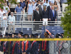 Republican presidential candidate former President Donald Trump, standing right with Melania Trump and her father, Viktor Knavs, attends a graduation ceremony for his son Barron at Oxbridge Academy Friday, May 17, 2024, in West Palm Beach, Fla. (AP Photo/Lynne Sladky)