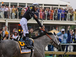 (AP Photo/Julio Cortez) Jaime Torres, atop Seize The Grey, reacts after crossing the finish line to win the Preakness Stakes horse race at Pimlico Race Course, Saturday, May 18, 2024, in Baltimore. 