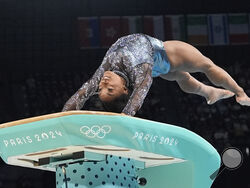 AP Photo/Charlie Riedel Simone Biles, of United States, competes on the vault during a women's artistic gymnastics qualification round at Bercy Arena at the 2024 Summer Olympics, Sunday, July 28, 2024, in Paris, France. 