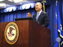 U.S. Attorney Nick Hanna announces charges against lawyer Michael Avenatti at a news conference in Los Angeles Monday, March 25, 2019. Hanna said there's no political connection to wire and bank fraud charges filed against Avenatti, who's a vocal critic of President Donald Trump. Hanna said the charges announced Monday began with Internal Revenue Service tax collection efforts and came to prosecutors in an ordinary way. The case alleges in part that Avenatti collected a $1.6 million settlement for a client 