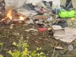 This frame grab from video shows wreckage from a plane that crashed by a home in Vinhedo, Sao Paulo state, Brazil, Friday, Aug. 9, 2024. (Felipe Magalhaes Filho via AP)