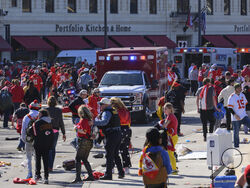 FILE - Police clear the area following a shooting at the Kansas City Chiefs NFL football Super Bowl celebration in Kansas City, Mo., Wednesday, Feb. 14, 2024. Three men from Kansas City, Mo.,, face firearms charges, including gun trafficking, after an investigation into the mass shooting during the Kansas City Chiefs’ Super Bowl parade and rally, federal prosecutors said Wednesday, March 13, 2024. (AP Photo/Reed Hoffmann, File)