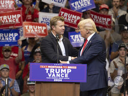 Republican Senate candidate Tim Sheehy shakes hands with Republican presidential nominee former President Donald Trump at a campaign rally in Bozeman, Mont., Friday, Aug. 9, 2024. (AP Photo/Janie Osborne)