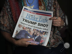 Donna Sybert, Managing Editor of the Butler Eagle newspaper, holds a Special Edition of the paper during an interview with The Associated Press, Wednesday, July 17, 2024, in Butler, Pa. (AP Photo/Matt Slocum)