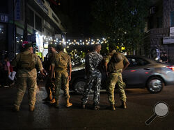 Lebanese soldiers stand guard at a street that leads to the American University hospital where they bring wounded people whose handheld pager exploded, in Beirut, Lebanon, Tuesday, Sept. 17, 2024. (AP Photo/Hassan Ammar)