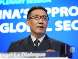 China's Defense Minister Dong Jun speaks during the 21st Shangri-La Dialogue summit at the Shangri-La Hotel in Singapore, Sunday, June 2, 2024. (AP Photo/Vincent Thian)