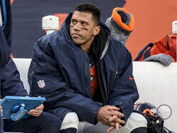 FILE - Denver Broncos quarterback Russell Wilson sits on the bench during the second half of an NFL football game against the Los Angeles Chargers, Sunday, Dec. 31, 2023, in Denver. Wilson has agreed to sign a one-year deal with the Pittsburgh Steelers, a person familiar with the details told The Associated Press on Sunday night, March 10, 2024. (AP Photo/David Zalubowski, File)
