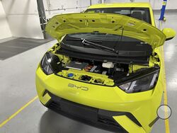 FILE - A BYD Seagull electric vehicle, with its hood open, is shown at the Caresoft Global facility April 3, 2024, in Livonia, Mich. China's BYD last year introduced the Seagull, a small EV that sells for just $12,000 in China. (AP Photo/Mike Householder, File)