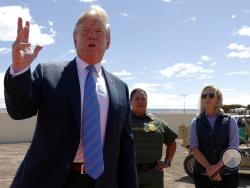 President Donald Trump speaks as he visits a section of the border wall with Mexico in Calexico, Calif., Friday April 5, 2019. (AP Photo/Jacquelyn Martin)
