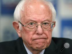 FILE - In this March 12, 2020, file photo Democratic presidential candidate, Sen. Bernie Sanders, I-Vt., speaks to reporters about coronavirus in Burlington, Vt. (AP Photo/Charles Krupa, File)