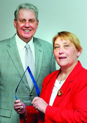 Bette Grey, right, clinic director and founder of the Columbia County Volunteers in Medicine receives the Outstanding Citizen award from presenter Steve Phillips of the Berwick Industrial Development Association.