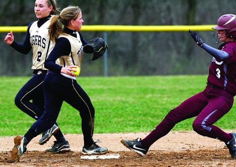 Southern Columbia's Kristen Blass, center, steps on the bag at second base as Loyalsock's Ally Pagana is called safe.