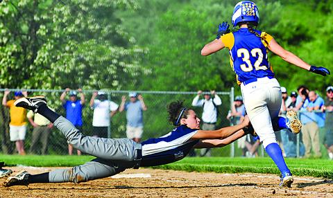 Berwick's Cassondra Dianese, left, dives to make the tag to out Valley View's Blayse Cholish just ahead of first base Wednesday at Marywood University. Berwick lost the District 2 title game, 2-0.