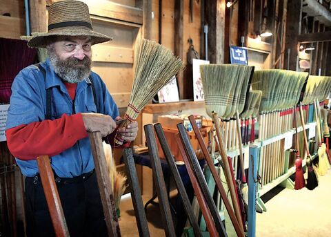 Broom maker John Paul Warren, Gilbertsville, works on a whisk broom in the barn in the historic area at the Bloomsburg Fair on Sunday, left. He said he started making brooms back in 1975 for the Bicentennial and never stopped.