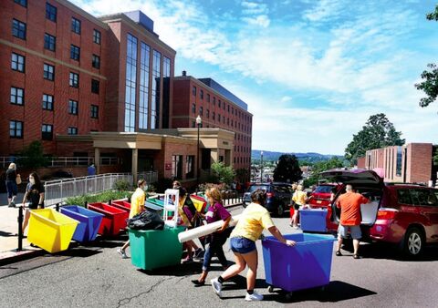 East Second Street in Bloomsburg is temporarily one-way as Bloomsburg University students move into Elwell Hall, at left, and other dorms Sunday. Welcome Week activities begin on Wednesday, with classes beginning next Monday.