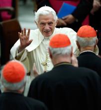 This Nov. 26, 2011 AP file photo shows Pope Benedict XVI waving as he leaves Paul VI hall after attending a concert of the Asturias Principality Symphony Orchestra directed by Chilean conductor Maximiano Valdes, at the Vatican. On Monday, Feb. 11, 2013 the Vatican announced that Pope Benedict XVI will resign on Feb. 28, 2013.