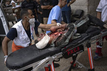 Palestinian wounded in Israeli bombardment is brought to a hospital in Deir al Balah, south of the Gaza Strip, Sunday, Oct. 29, 2023. (AP Photo/Fatima Shbair)