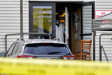 FILE - A hazmat team works inside Schemengees Bar & Grille, Sunday, Oct. 29, 2023, in Lewiston, Maine. Police in Maine feared confronting Robert Card, an Army reservist in the weeks prior to the worst mass shooting in state history would “throw a stick of dynamite on a pool of gas,” according to footage released by law enforcement, Dec. 22. (AP Photo/Matt York, File)