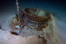 This image provided by Bezos Expeditions shows a thrust chamber of an Apollo F-1 engine on the bottom of the Atlantic Ocean in March 2013. An expedition led by Amazon CEO Jeff Bezos pulled up two rocket engines, including this one, that helped boost Apollo astronauts to the moon. Bezos and NASA announced the recovery on Wednesday, March 19, 2013. The sunken engines were part of the Saturn V rocket used to bring astronauts to the moon during the 1960s and 1970s. After liftoff, they fell into the ocean as pla