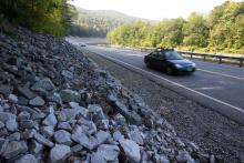 In this Aug. 22, 2013 photo, cars travel on the rebuilt Vermont Route 107 in Bethel, Vt. After rising for decades, total vehicle use in the U.S. peaked in August 2007. It then dropped sharply during the Great Recession and has largely plateaued since. (AP Photo/Toby Talbot)