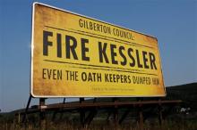 A billboard paid for by The Coaltion to Stop Gun Violence that says: "Gilberton Council: Fire Kessler Even The Oath Keepers Dumped Him" is on Rt. 924 in the northbound lane outside of the Gilberton, Pa. exit Tuesday evening, August 20, 2013. Gilberton Police Chief Mark Kessler was suspended for thirty days after videos showing him cursing and firing automatic weapons. (AP Photo/The Republican Herald, Jacqueline Dormer)