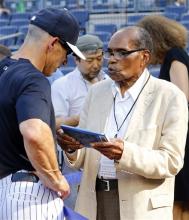 Bernando LaPallo, right, talks with New York Yankees manager Joe Girardi during batting practice before a baseball game against the Boston Red Sox at Yankee Stadium in New York, Saturday, June 1, 2013. (AP Photo/Paul J. Bereswill)