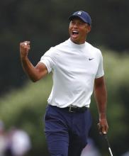 Tiger Woods reacts to his birdie putt on 15 during the second round of the Masters golf tournament Friday, April 12, 2019, at Augusta National Golf Club in Augusta, Ga. (Curtis ComptonAtlanta Journal-Constitution via AP)