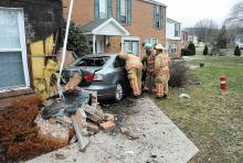 This Volkswagen smashed in this apartment rented by Don Fulmer at the Montgomery Village Apartments in Mahoning Township Friday afternoon. Fulmer was sitting on a chair just feet from the wall when the car hit the building. (Press Enterprise/Keith Haupt)