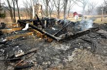 A fire early Friday morning at this home along South Smith Road in Rush Township claimed the lives of three children 13-year-old Daniel Gage Dissinger, 7-year-old Gavin Arthur Dissinger, and 2-year-old Arthur Dissinger. Southside Fire Chief Clifford Kriner said the fire at 60 South Smith Road had fully engulfed the house by the time firefighters arrived at 1:20 a.m. (Press Enterprise/Keith Haupt)