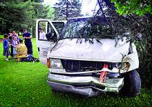 After crashing through fences, shrubs, a utility pole and a tree, a van carrying several children and driven by Jacob Thomas Konkolics, 18, of Espy, rests in a front yard along Old Berwick Road in South Centre Township on Tuesday morning. (Bill Hughes/Press Enterprise) 