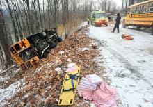 This school bus crashed and rolled onto its side after the driver hit a slick spot on top of Klein Road in Valley Township Tuesday morning. The 14 students on board were traveling to Columbia-Montour Vo-Tech.