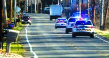 Three police cars chase a stolen box truck down Old Berwick Road. (Press Enterprise/M.J. Mahon)