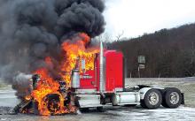 A Tom Bowman tractor goes up in flames Thursday afternoon in Orangeville. (Special to the Press Enterprise/Chad Zimmerman)