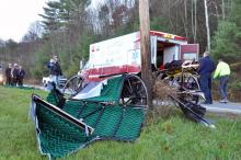 Medics load a female occupant of a buggy struck by an automobile into a Millville Ambulance on Wednesday morning. (Press Enterprise/Harry Watts)