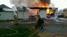 Flames rip through a garage at 20 Water St., Washingtonville. (Press Enterprise/Jimmy May)