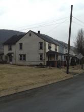 This is the double house at 28-30 Italy St., where officials say firefighter Corey Michael Davis intentionally set two small fires on Jan. 31 (Press Enterprise/John-Erik Koslosky)