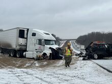 Press Enterprise/Susan Schwartz Firefighters help clean up the scene after a serious crash on Interstate 80 Thursday morning.