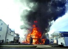 Press Enterprise/Bill Hughes Vinyl siding melts on structures to the left and the right of a fully involved garage fire behind 339 East 8th Street in Berwick on Sunday afternoon. Quick work by Berwick firefighters kept the structures from actually catching on fire. 