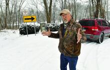 Press Enterprise/Jimmy May Jeff Hoper stands along the old section of West Fort McClure Boulevard Friday, where he would park to go fishing. The town of Bloomsburg now doesn't want people parking in that area. 